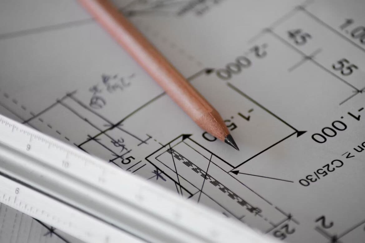 Pencil resting on a technical engineering drawing