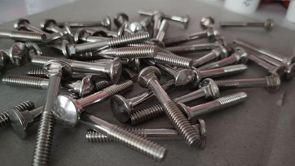 Pile of metal bolts and fasteners