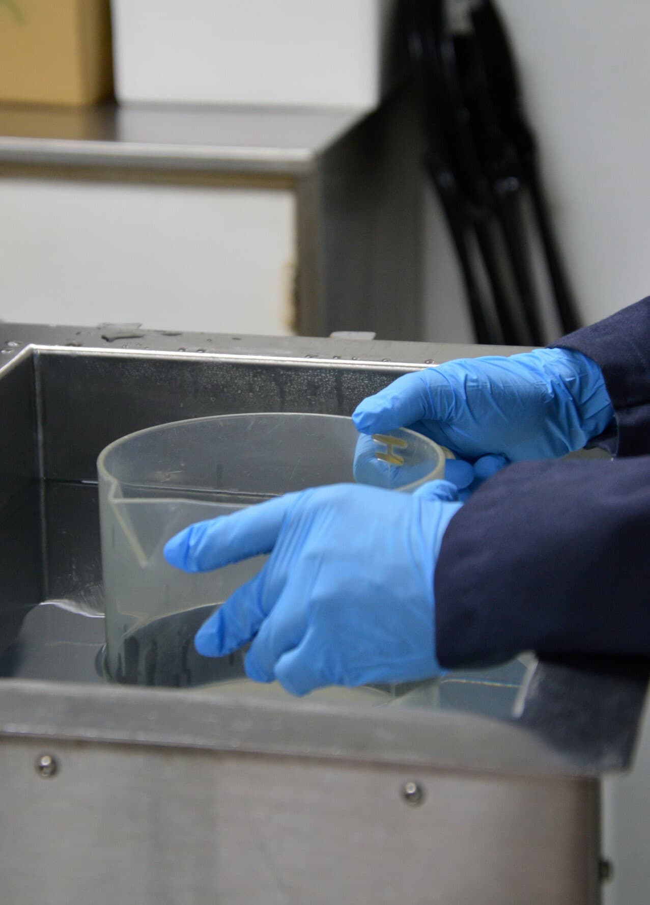 Technician working at a cleanliness testing laboratory station