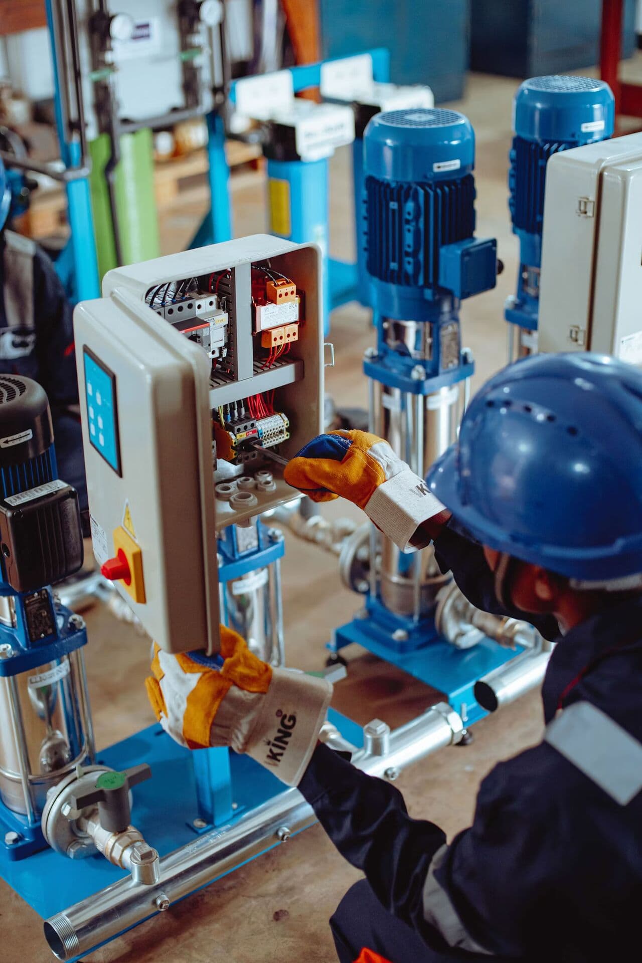 Technician performing industrial equipment maintenance