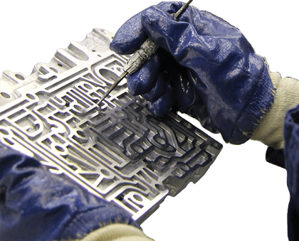 Technician manually cleaning a component