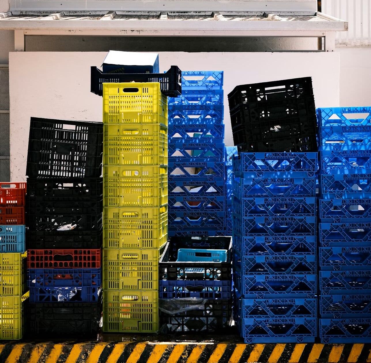 Stacks of clean reusable plastic dunnage