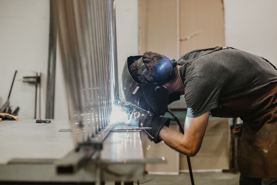 Welder fabricating metal equipment