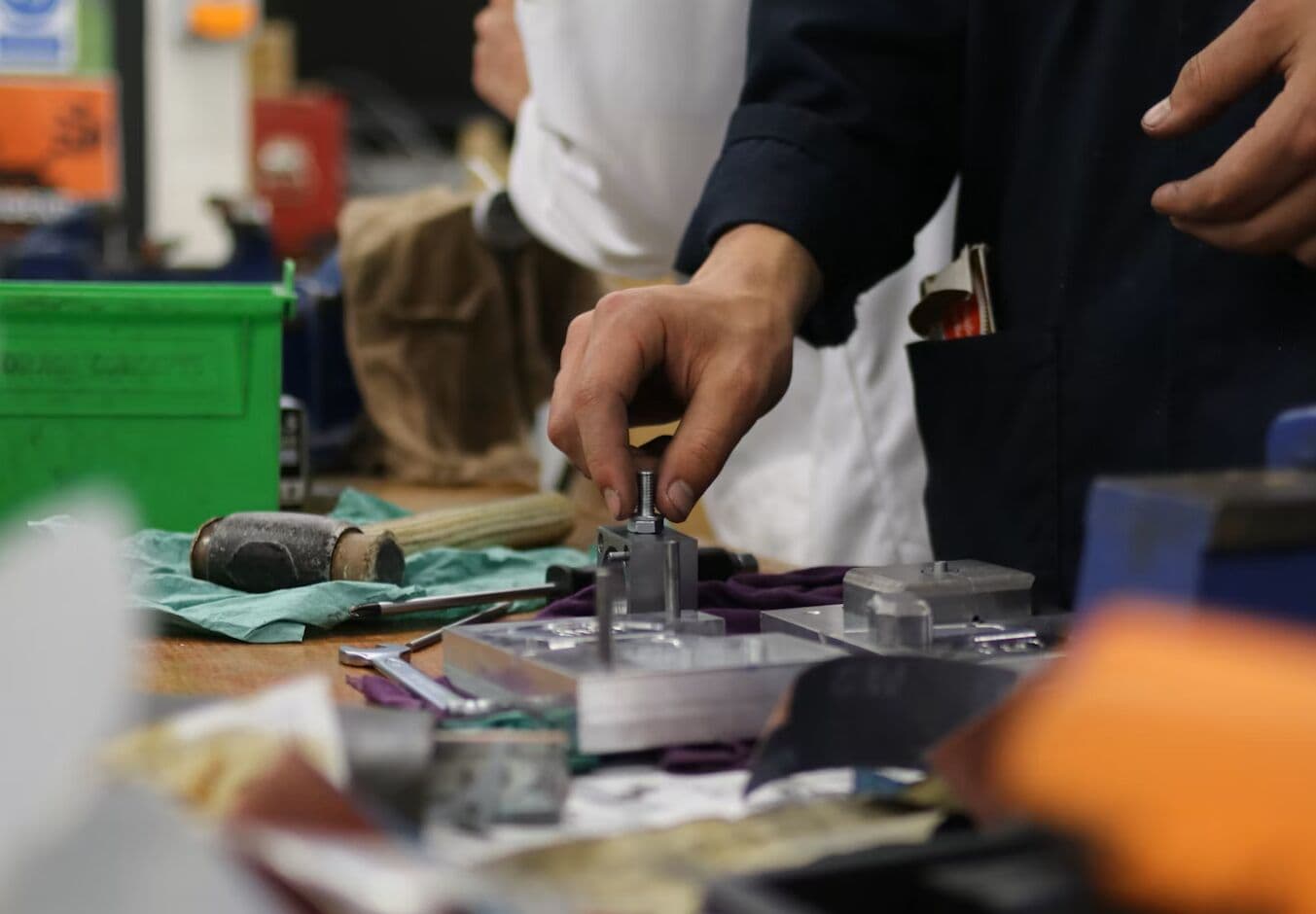Worker assembling components by hand