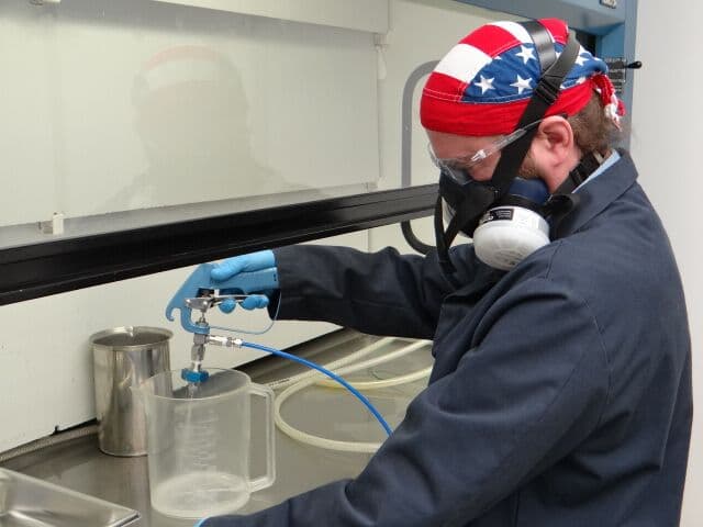 Technician preparing a blank test for cleanliness testing validation