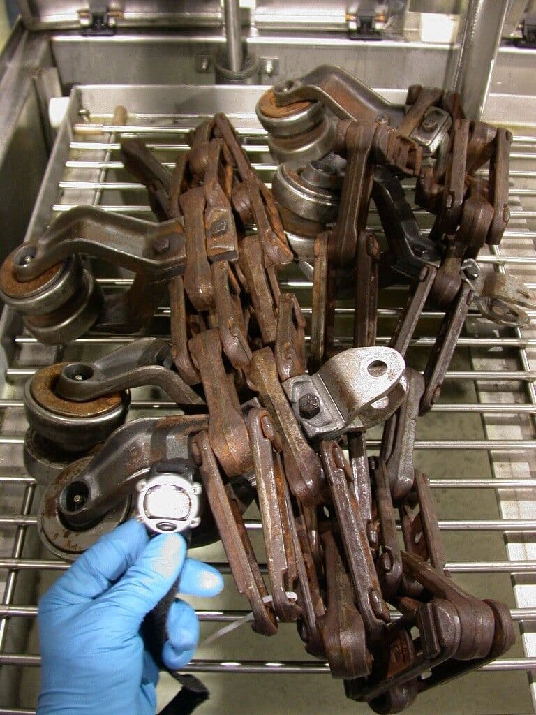 Rusty metal chains before industrial rust removal