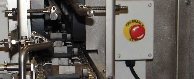 Emergency stop control on an industrial washing system